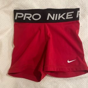Nike Pros
XS
3 inch
Red with Black Waistband